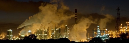 Steam rising from a city at night